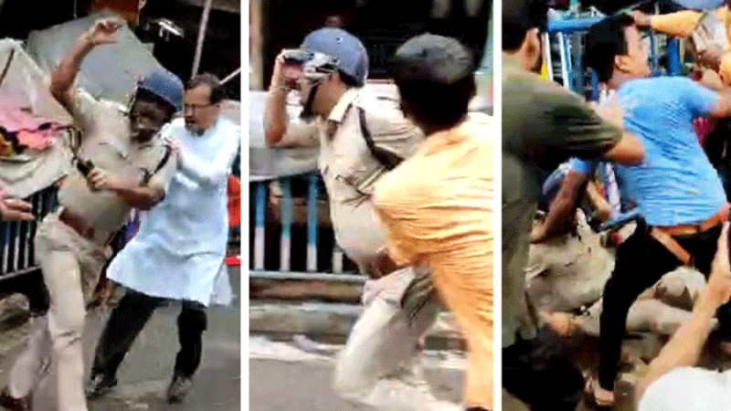 পুলিশ কর্মকর্তাকে রাস্তায় ফেলে পিটুনি