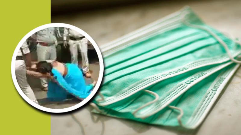 মাস্ক না পরায় এক নারীকে পুলিশের কিল-ঘুষি-লাথি!